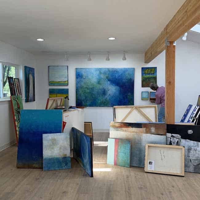 Getting Ready for Open Studios Art studio being prepared for Open Studios, where paintings become a starting point for conversation and connection.