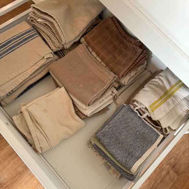 towels First world problems: neatly folded kitchen towels stacked in a drawer